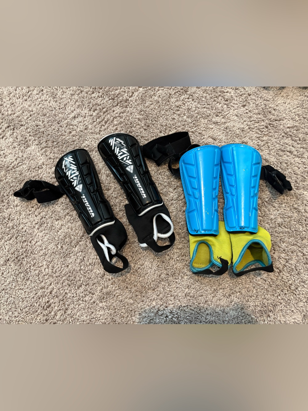 Two pairs soccer shin guards - small
